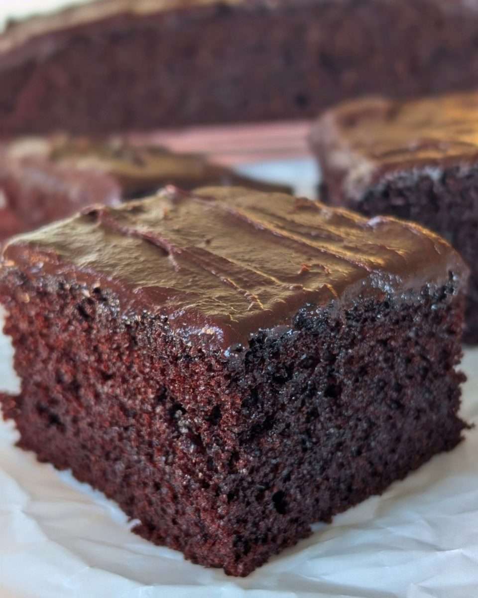 a generous slice of soft and tender chocolate slab cake